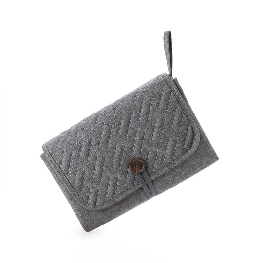 tapis à langer nomade gris