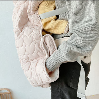 couverture de portage douillette fixée au porte-bébé
