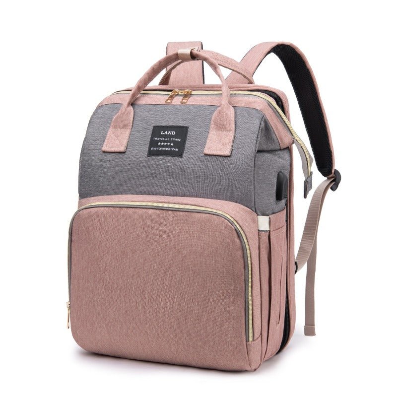 sac à dos à langer avec lit pliable gris et rose
