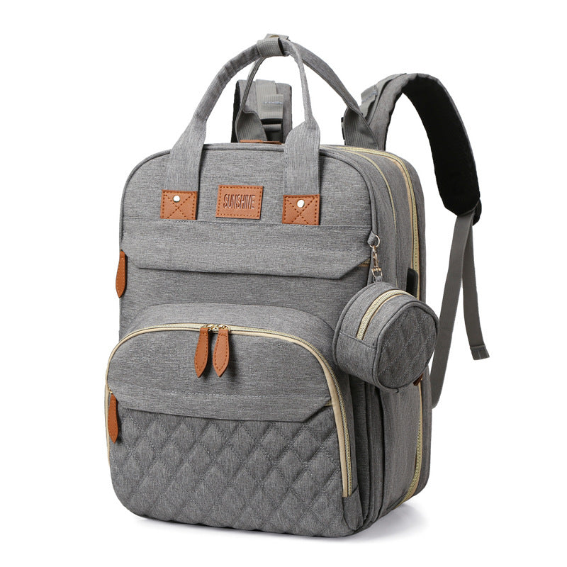 sac à dos à langer lit portable couleur brume douce