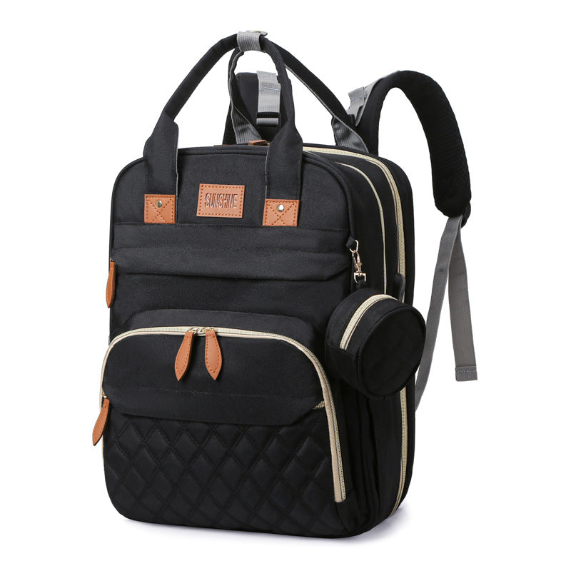 sac à dos à langer lit portable couleur noir intemporel