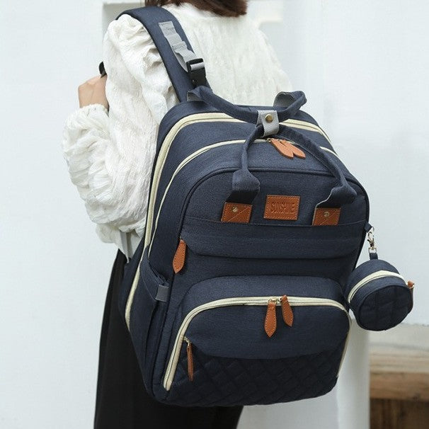 sac à dos à langer porté sur une épaule