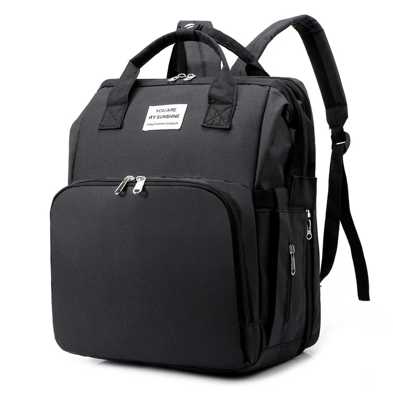 sac à dos à langer transformable noir