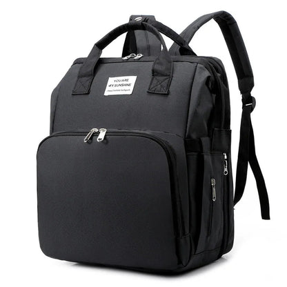 sac à dos à langer transformable noir