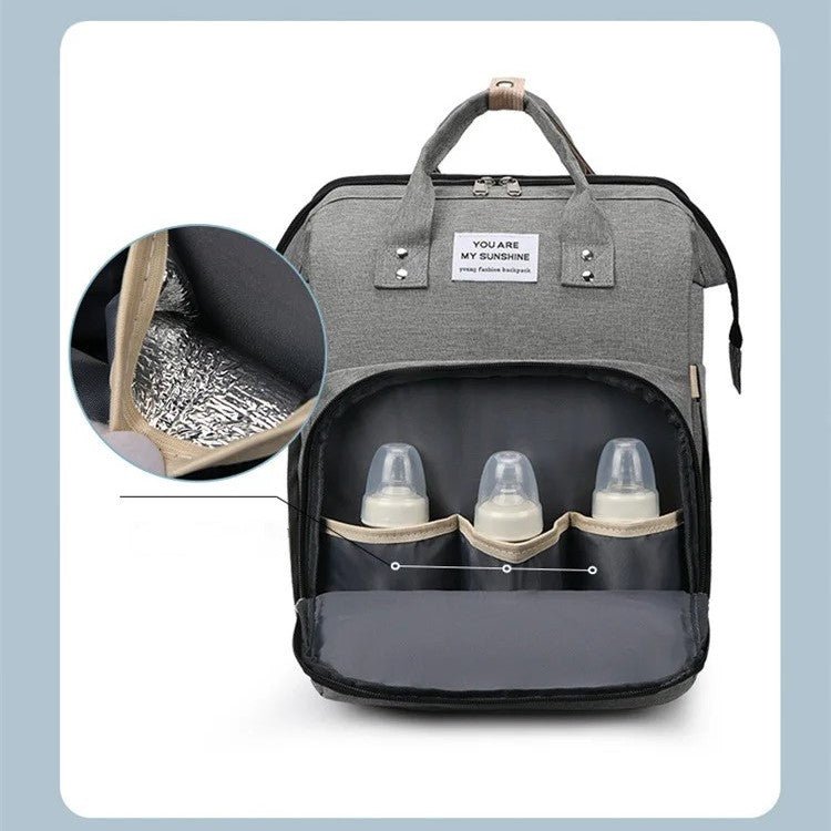 sac à dos à langer transformable compartiment isotherme pour biberons