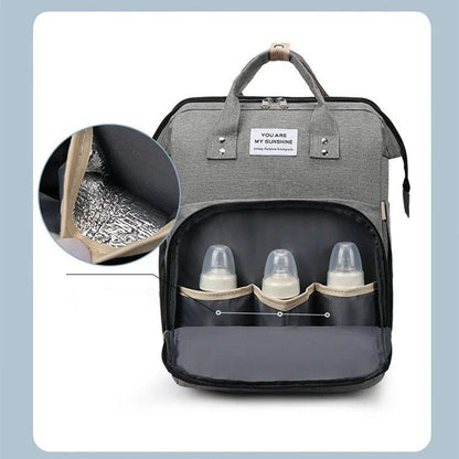 sac à dos à langer transformable compartiment isotherme pour biberons