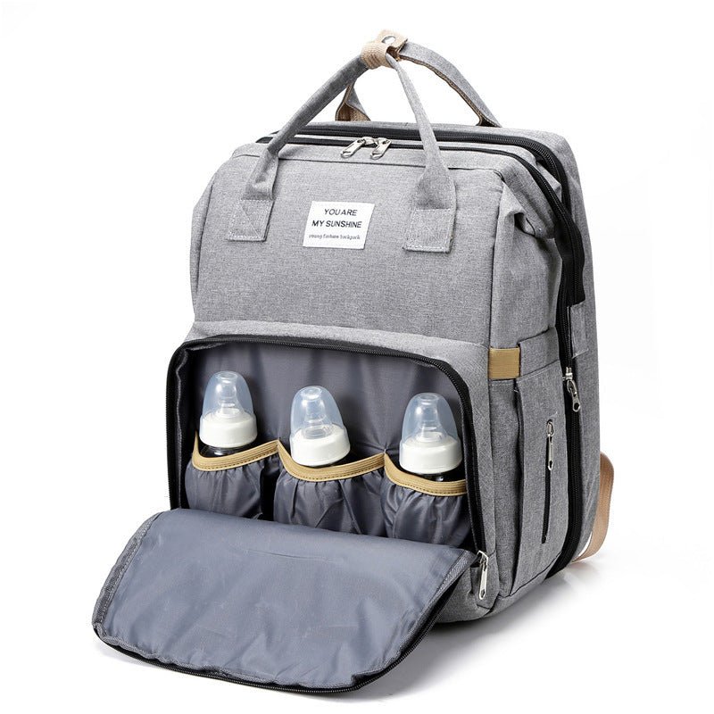 sac à dos à langer transformable compartiment pour biberons