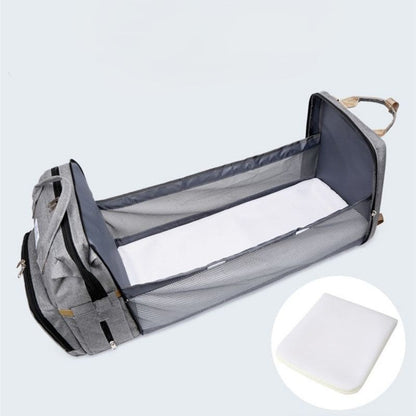 sac à dos à langer transformable avec tapis à langer
