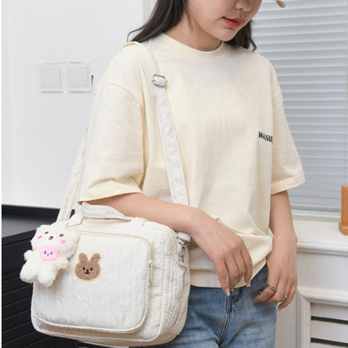 sac langer cuddlebear™ porté en bandoulière
