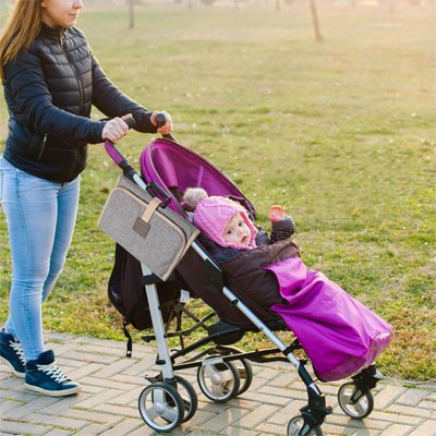 Tapis à langer imperméable nomade accroché à la poussette 