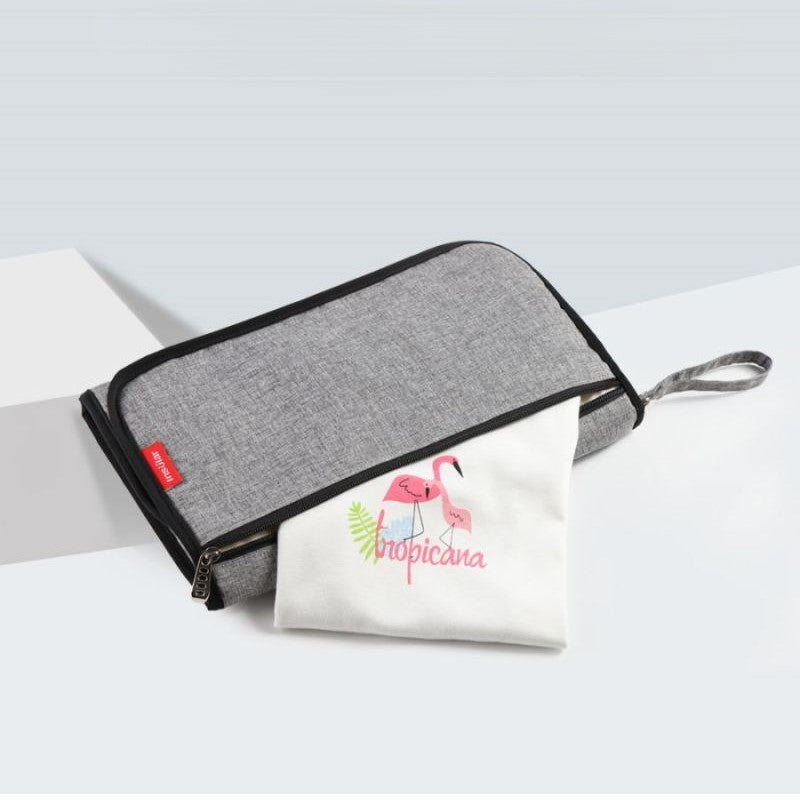 tapis à langer nomade compact avec pochette extérieure