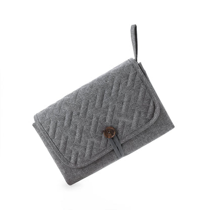 tapis à langer nomade gris