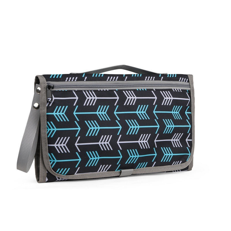 tapis à langer nomade noir avec motif de flèches
