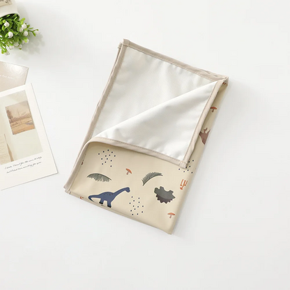 Tapis langer nomade compact et imperméable motif Aventure Dino